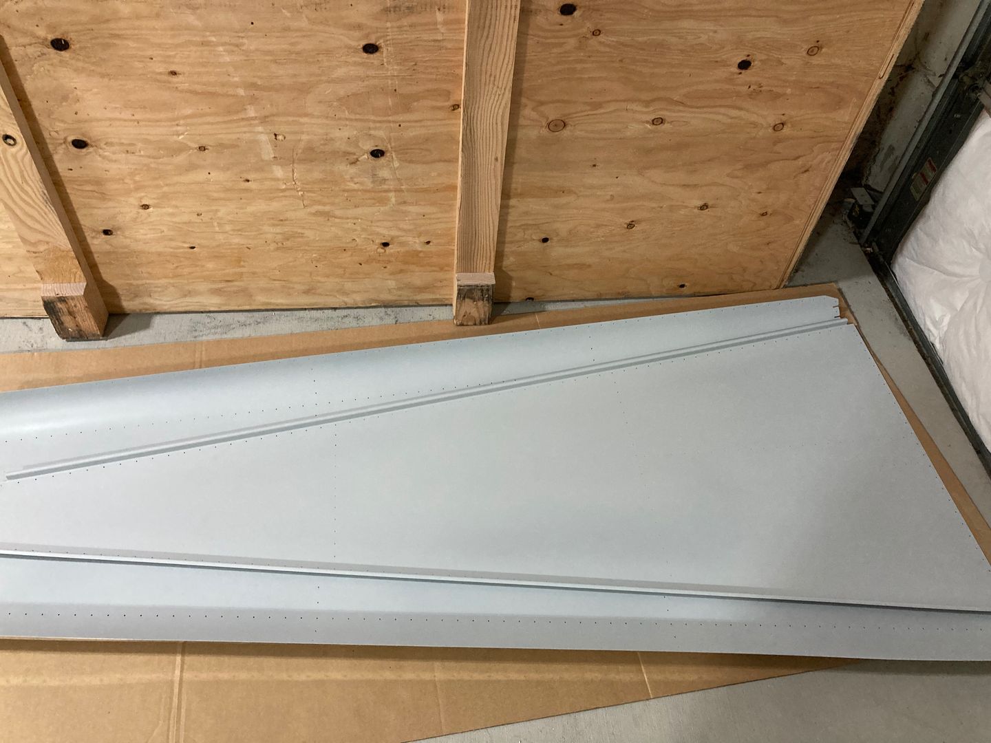 The aft fuselage skins are primed.