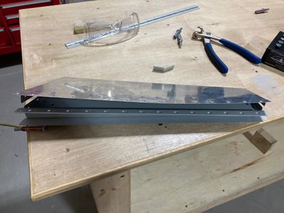 Trim tab spar backriveted.