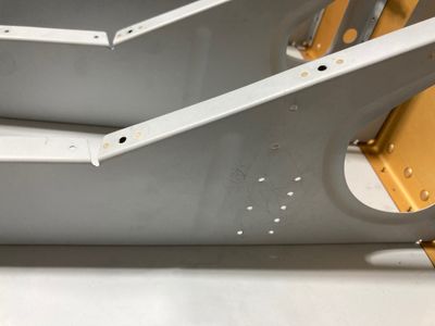 The old bracket is drilled out.