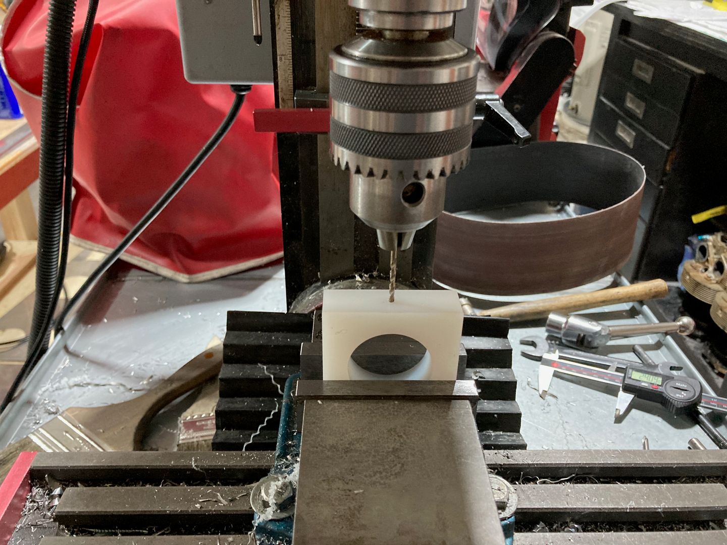 Drilling the plastic block.