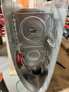 Riveting the fifth rib