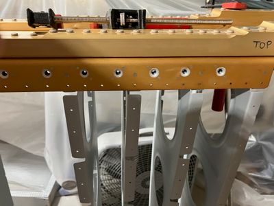The foremost main rib rivets.
