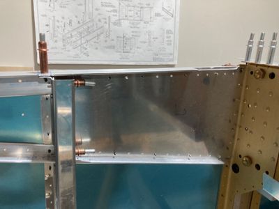 The left gear attach web drilled.