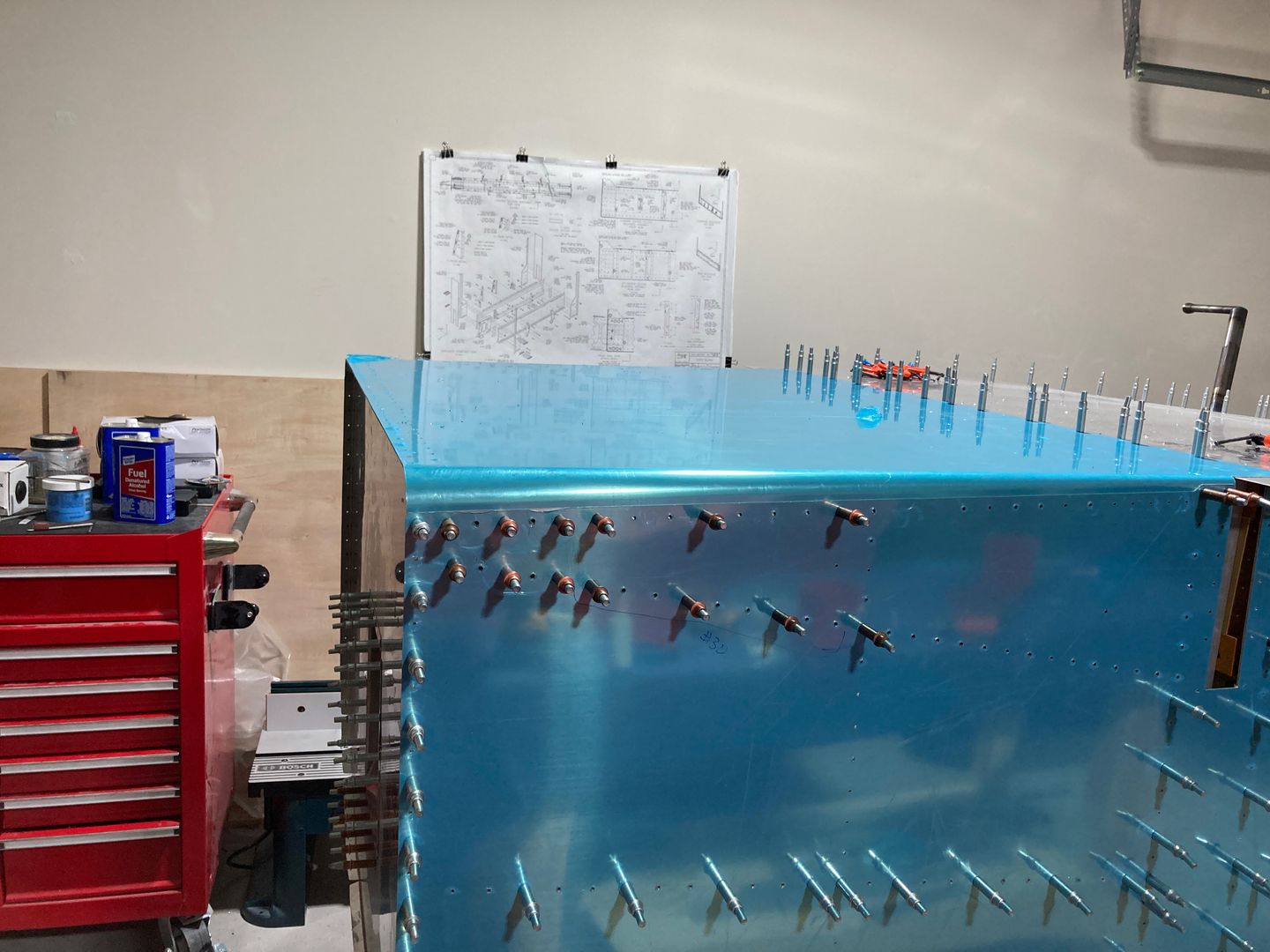 The lower longeron is partially drilled.