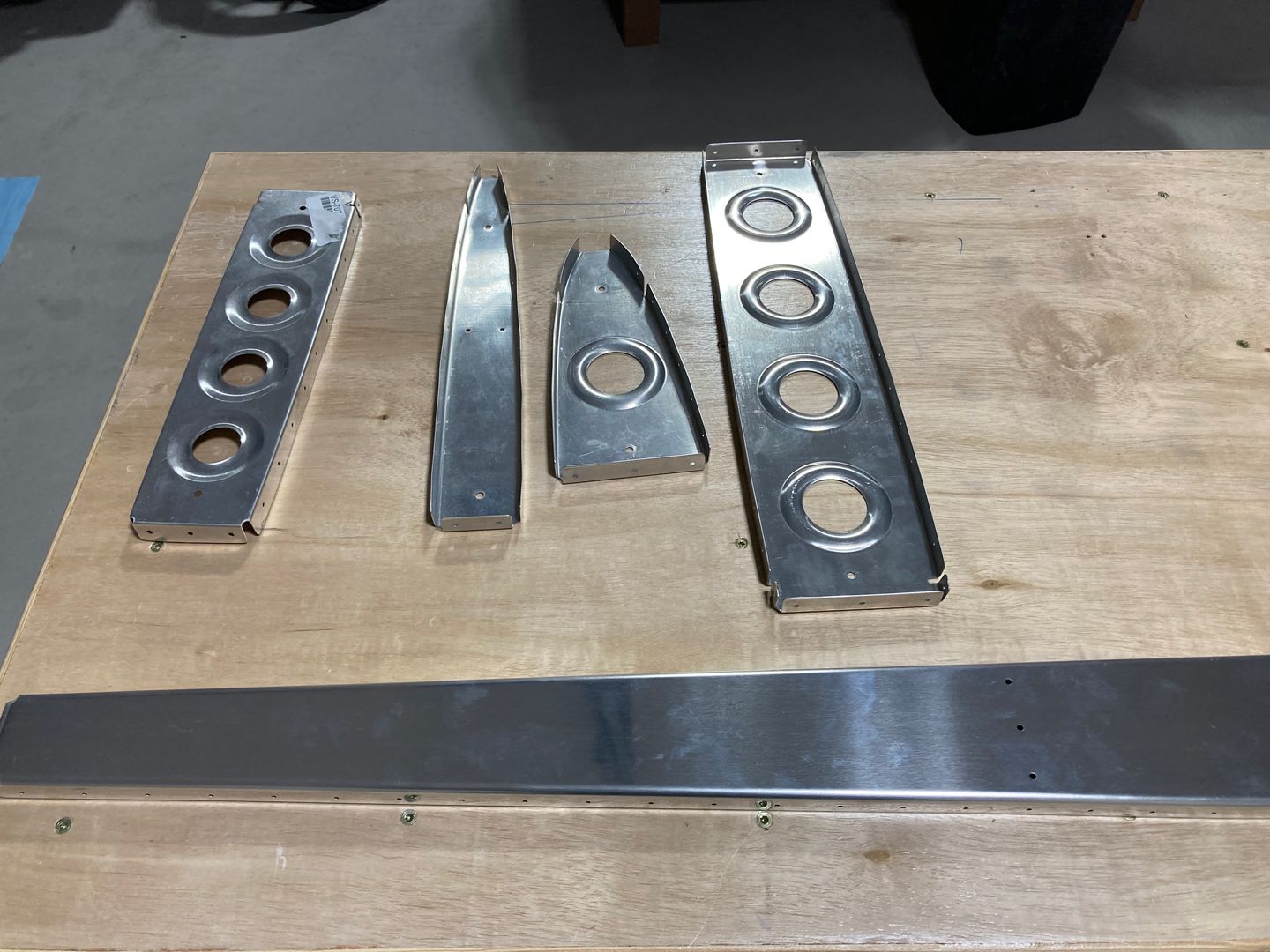 New parts are drilled and ready to get cleaned and primed.