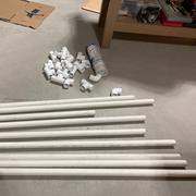 Parts for the paint booth: 9 1-1/4" PVC pipes, 6 right angles and 13 tees.