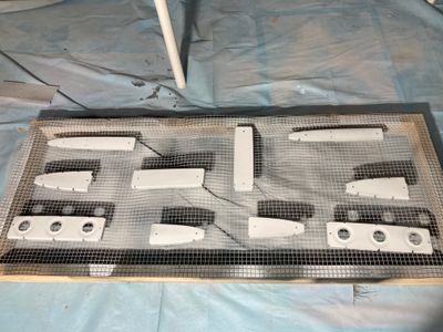 The parts are sprayed with the primer.