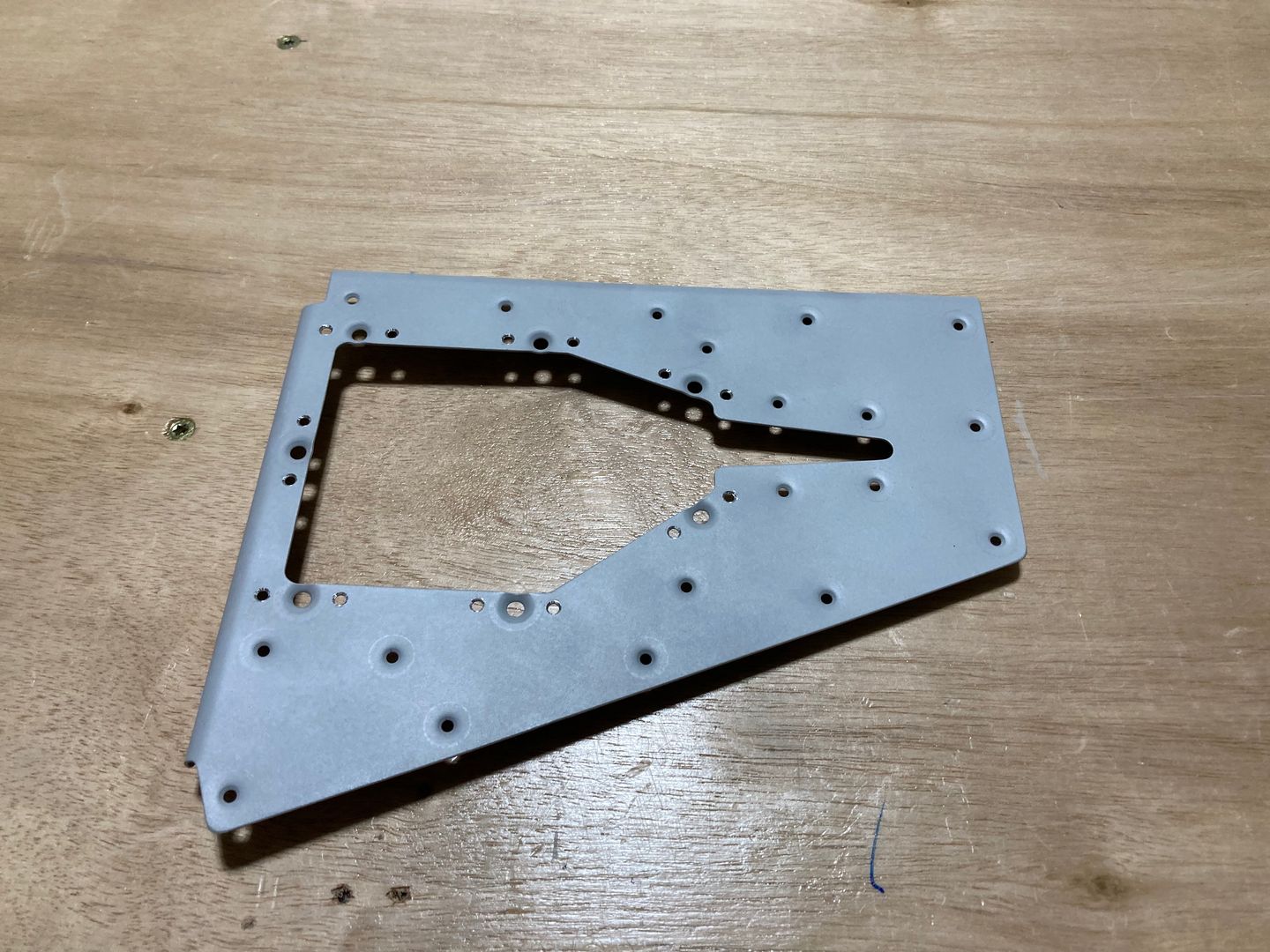 The trim access reinforcement plate dimpled and counter-sinked.