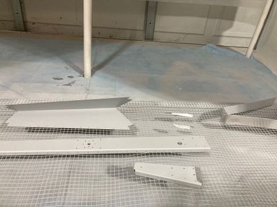 Priming the trim tab skin and rebuilding the bearing assembly