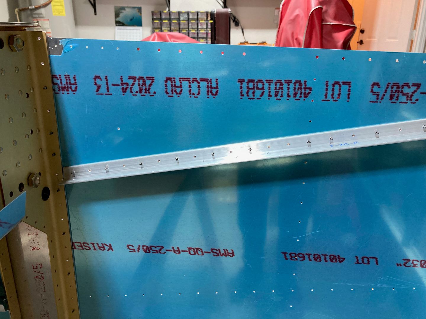 The right auxiliary longeron is drilled.
