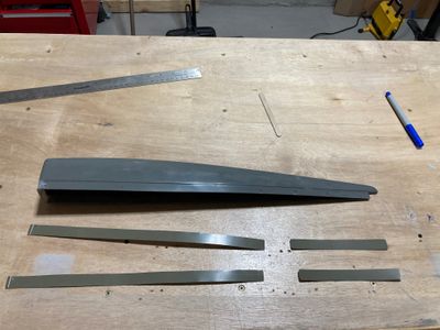 The rudder top fairing and the aluminum backing plates.