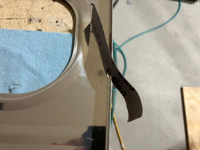 Using sandpaper to deburr.