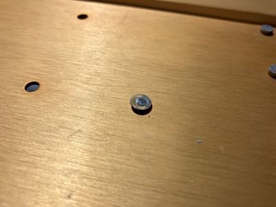 The sheared rivet.