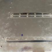 Stiffeners riveted to skins