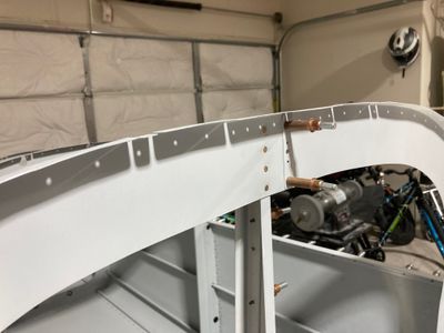 The top four rivets of the bellcrank channel.