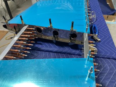 Rib drilled to the rear spar.