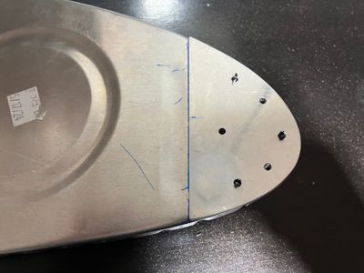 The reinforcing plate.