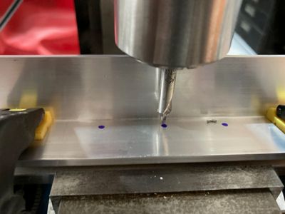 Aligning the holes by eye.