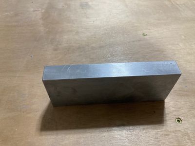 An aluminum bar for the fixture.