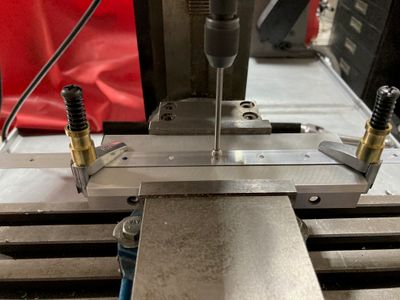 Centering the spindle over the hole.
