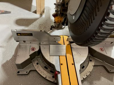 Cutting the angle using the miter saw.
