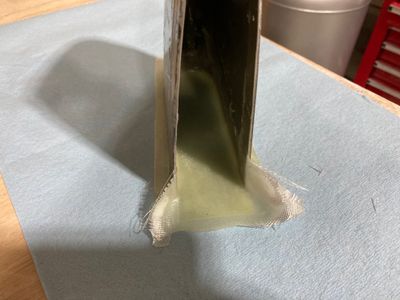 End cap reinforced with fiberglass cloth.