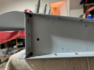 Riveting the flap.