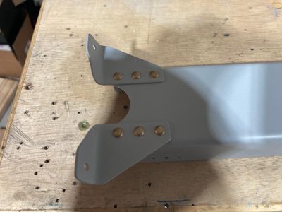 Riveting parts to the F-766A flaps actuator channel.