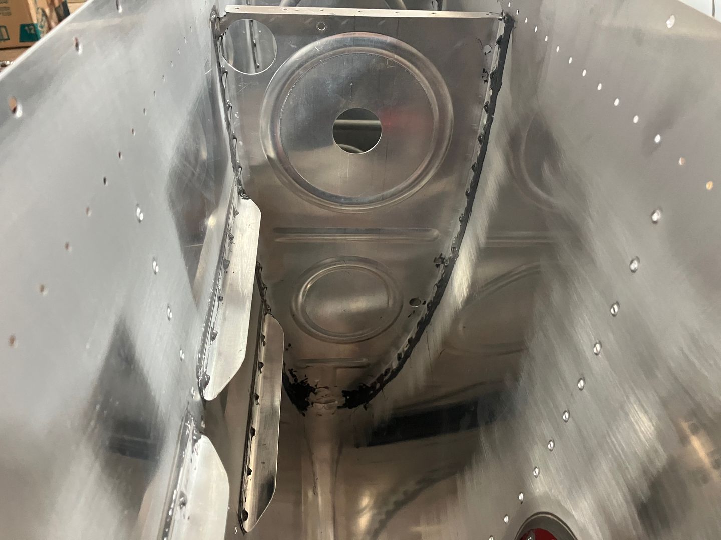 The rib is fully riveted.