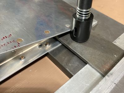 Setup for setting last rivet