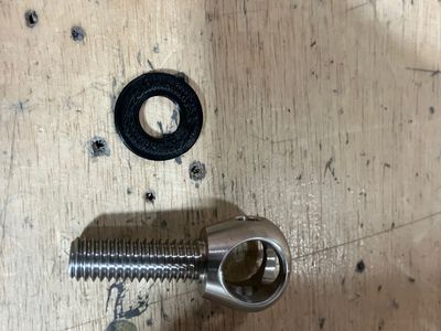 The tie-down ring and the printed spacer.