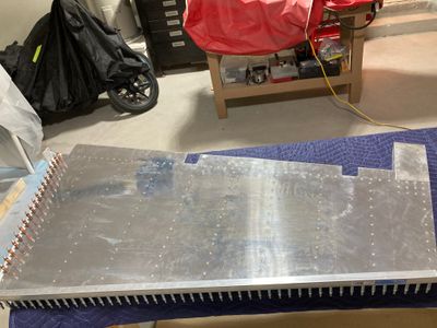 The partially riveted rudder.
