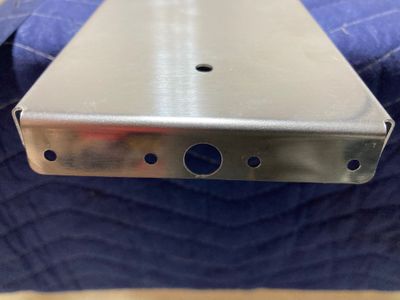 Upsized hole on the flange.