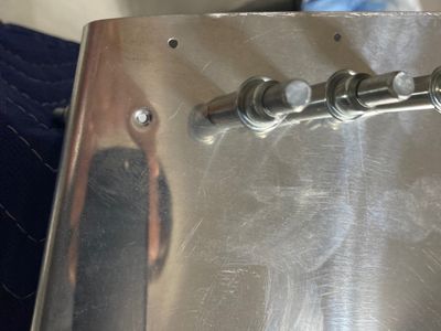 Aligning an existing hole with the rib.
