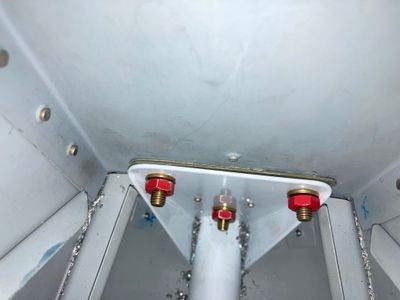 The bottom bolts.