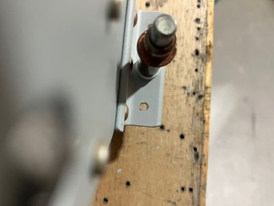 The elongated hole in the aileron hinge
