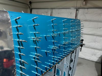 Finished drilling the fuel tank skin.