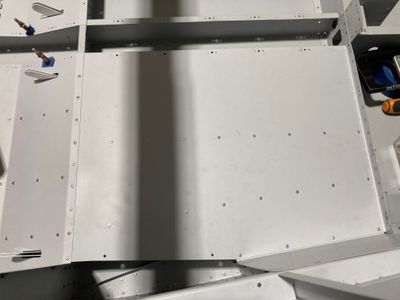 Riveted the gussets and the left baggage floor