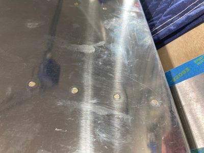 The "oops" rivet on the skin side.