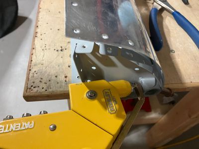 Riveting the nose ribs to the pipe.