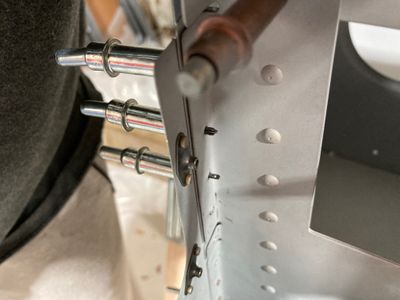 Shimming the bulkhead flange.
