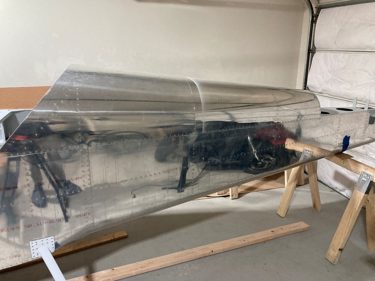 The aft skins are riveted.