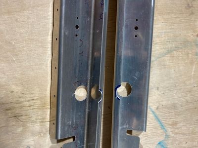 Drilled the rudder cable holes in the bulkheads.