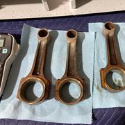 The connecting rods.