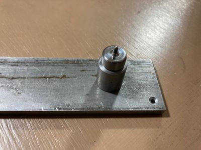 Dimpling bucking bar with a rivet gun adapter for a die