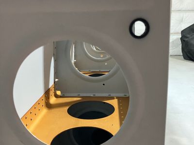 A hole drilled through the rib.