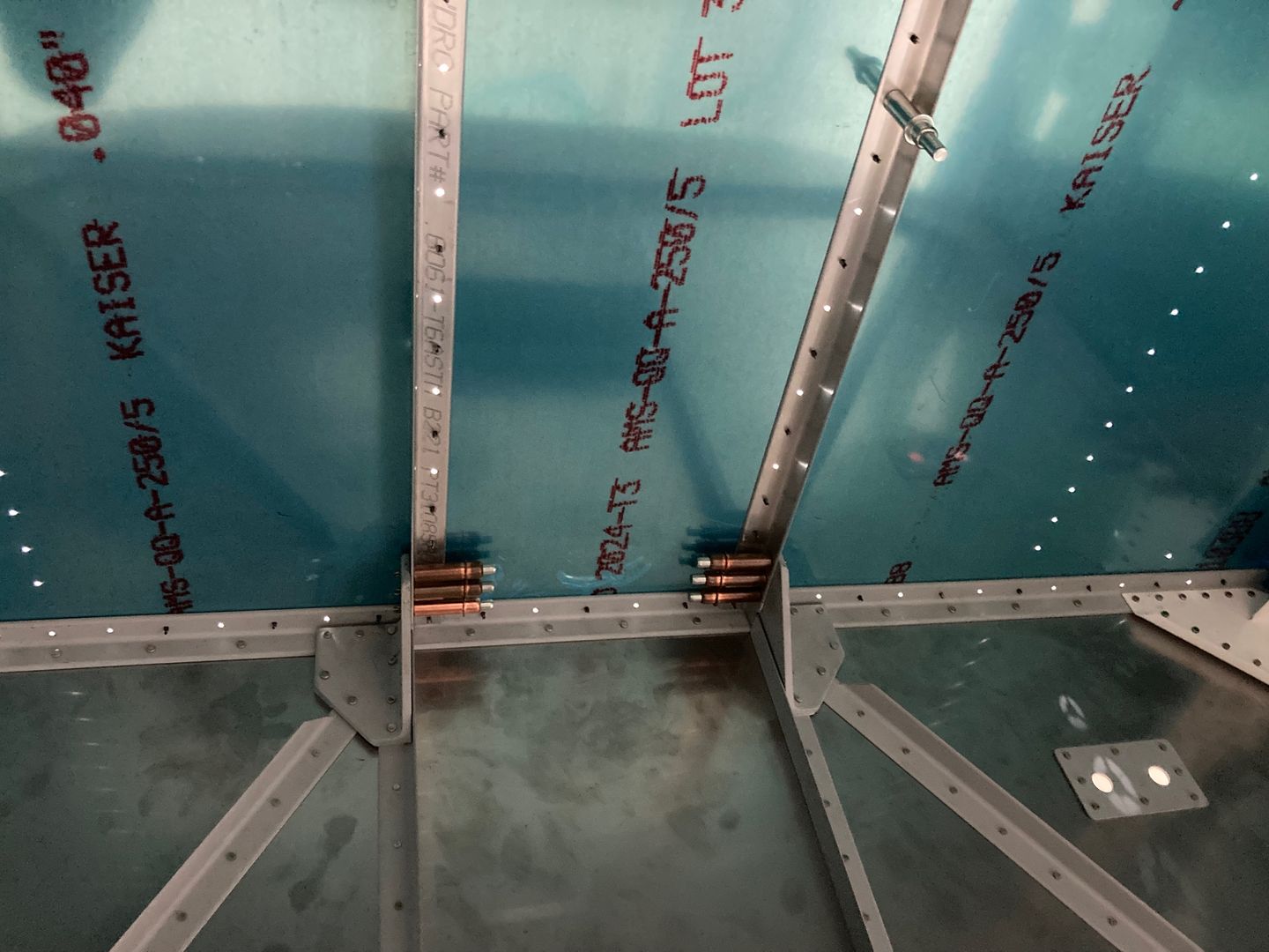 Holes in the firewall angles are drilled.