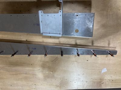 Both the bellcrank rib and the bellcrank channel are drilled.