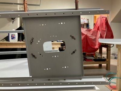 Riveted ELT bracket to the bottom J-stiffener.