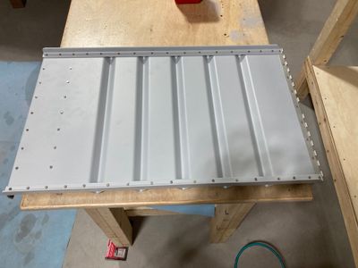 Riveting the seat backs and pushrods